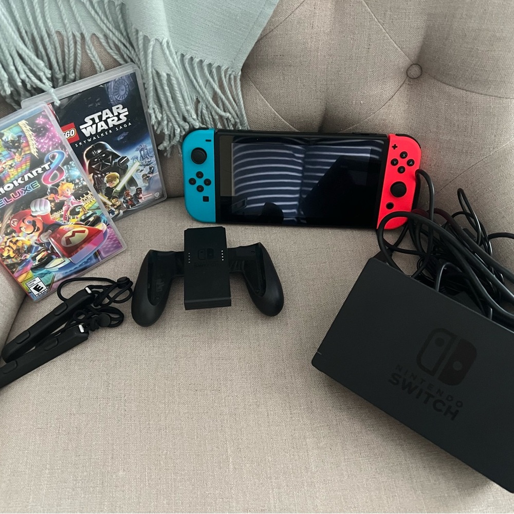 Like new Nintendo Switch with 2 games. Used 3 times; includes accessories.